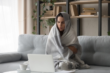 woman feeling cold at home