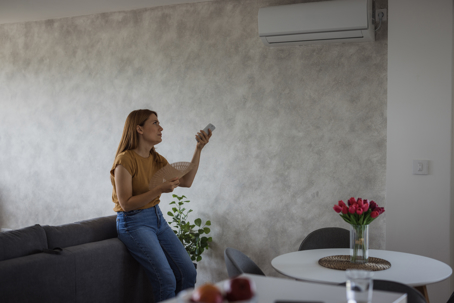 woman feeling the heat at home